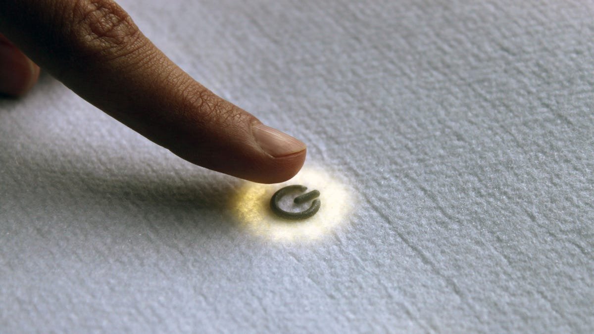 An example of Loomia's e-textile with a button being pressed with an index finger